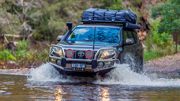 Car crossing river: Risky maneuver, proceed with caution