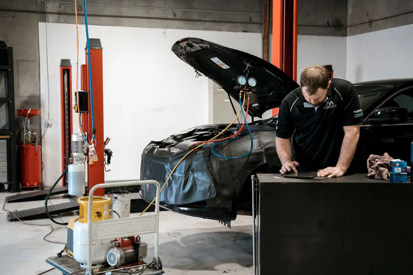 Mechanic fixing a car's internal components