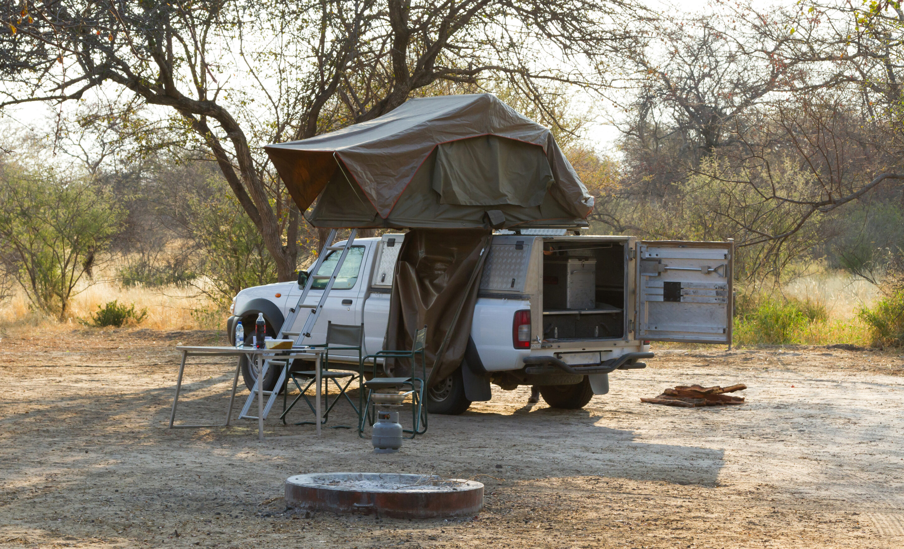 Must-Have 12V Accessories For Off-Road & Camping Trips - Offroad 4x4 vehicle with tent in the roof